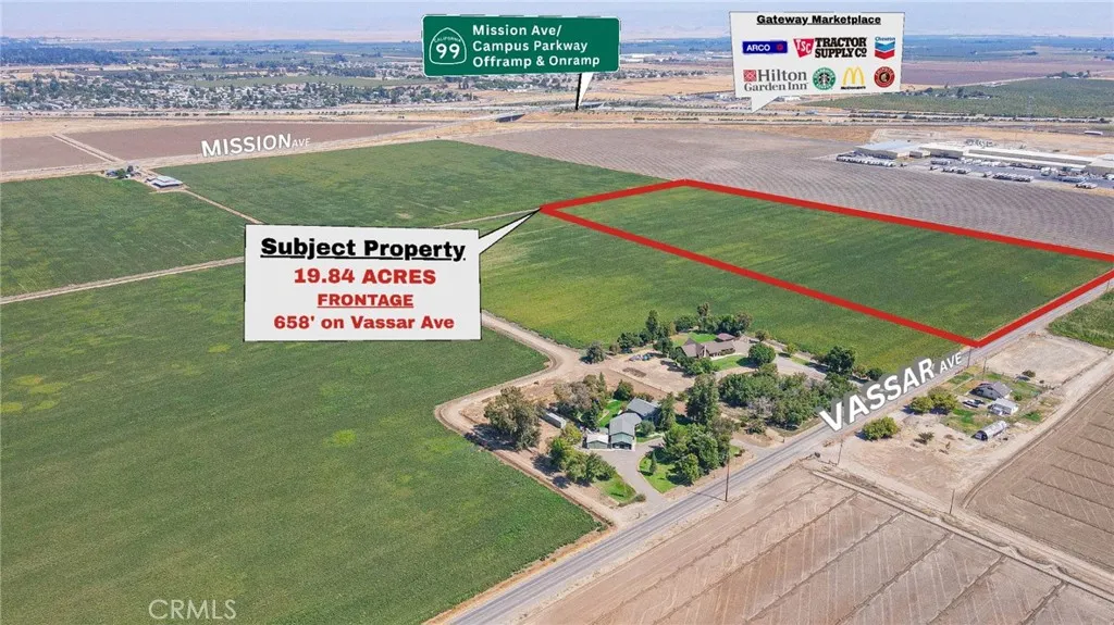 0 Vassar Merced, CA 95341 - Photo 4 of 20 a sign that is sitting in the grass next to a road