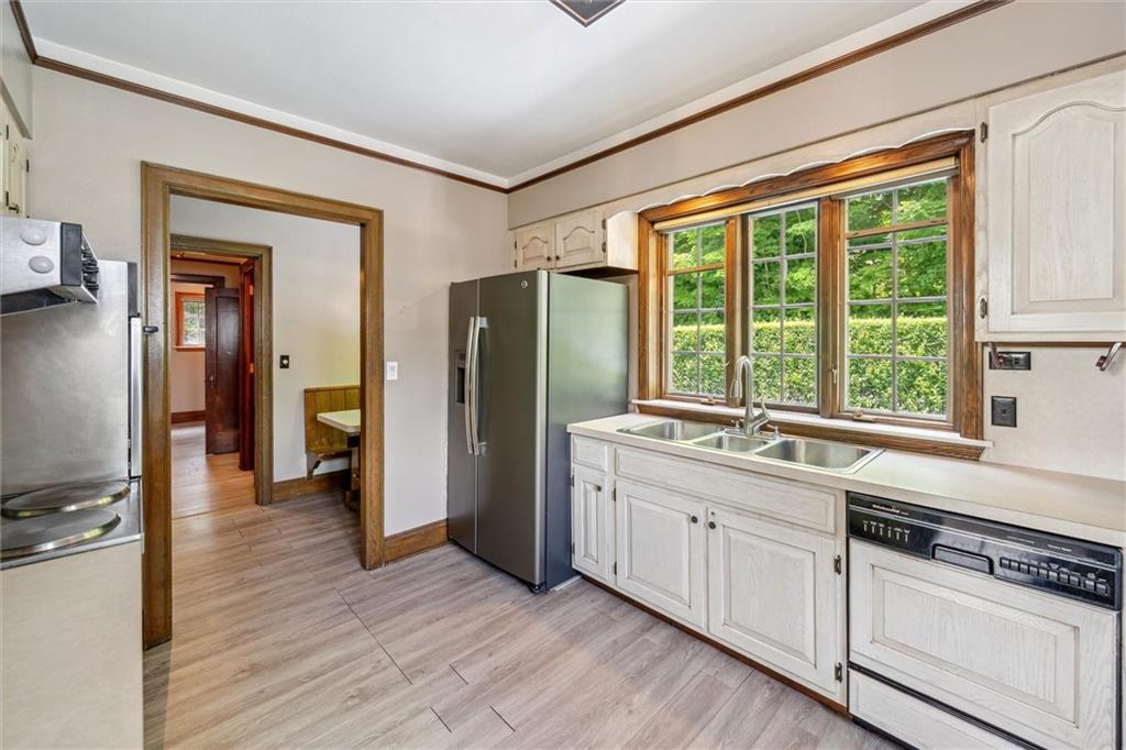 705 Chestnut Street Emlenton, PA 16373 - Photo 11 of 48 a kitchen with stainless steel appliances granite countertop a refrigerator and a sink