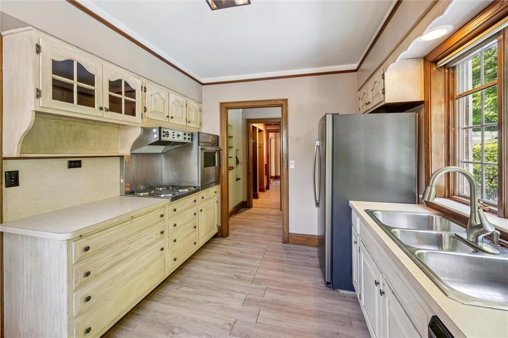 705 Chestnut Street Emlenton, PA 16373 - Photo 13 of 48 a kitchen with stainless steel appliances granite countertop a sink and a refrigerator