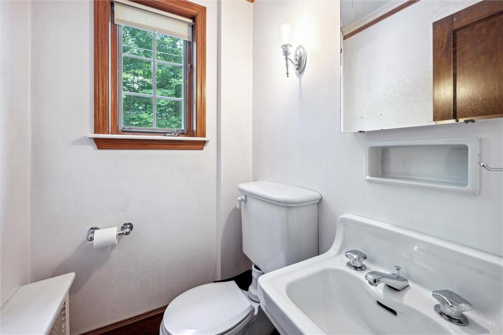 705 Chestnut Street Emlenton, PA 16373 - Photo 17 of 48 a bathroom with a sink a toilet and mirror