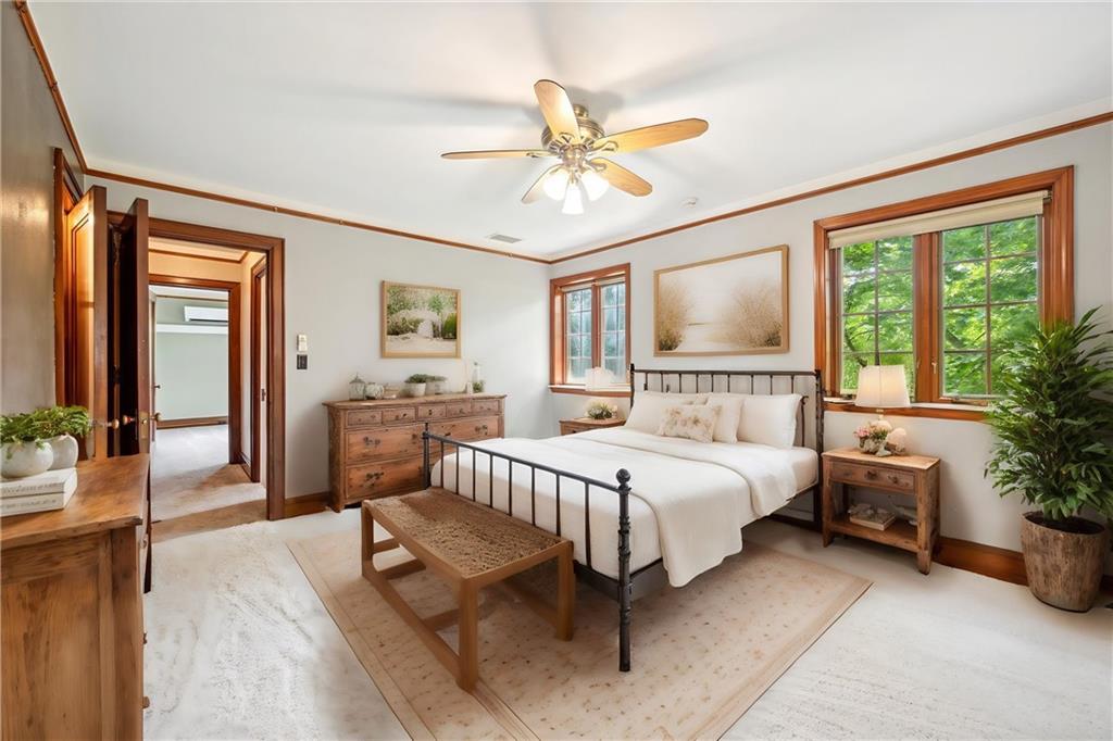 705 Chestnut Street Emlenton, PA 16373 - Photo 20 of 48 a spacious bedroom with a large bed and a chandelier