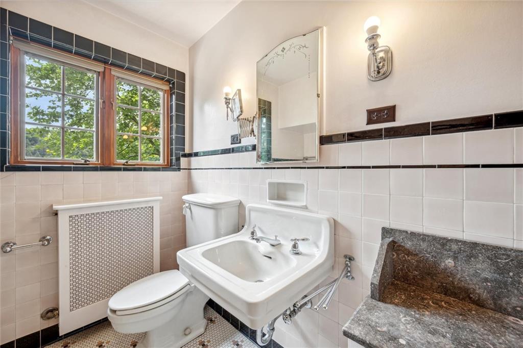 705 Chestnut Street Emlenton, PA 16373 - Photo 22 of 48 a bathroom with a toilet sink and mirror