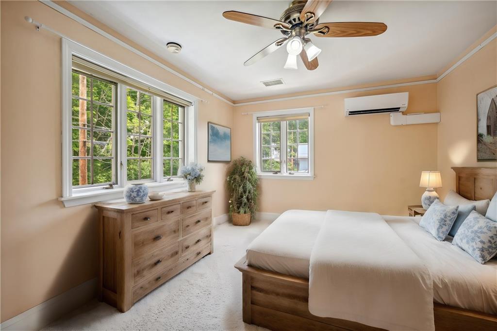 705 Chestnut Street Emlenton, PA 16373 - Photo 24 of 48 a bedroom with a large bed and a chandelier fan