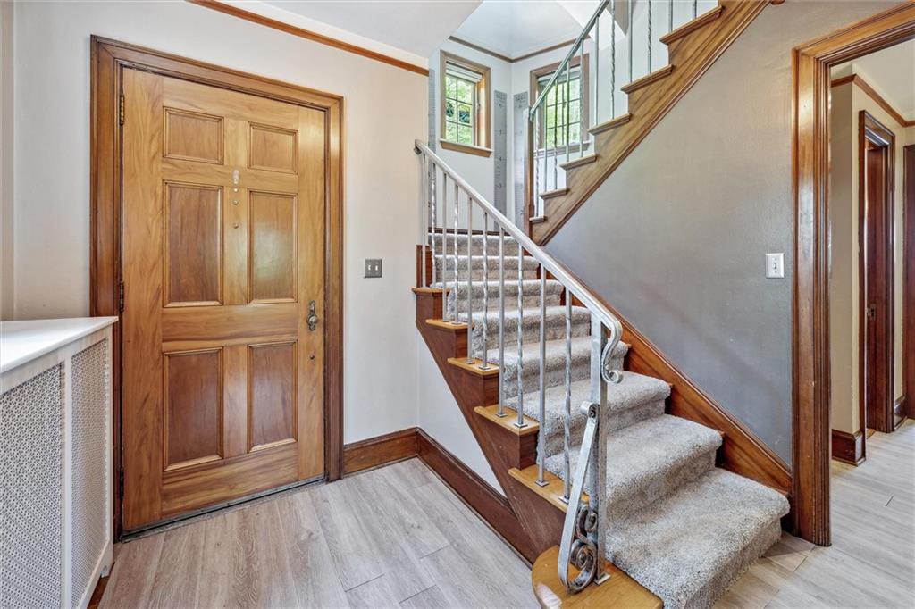 705 Chestnut Street Emlenton, PA 16373 - Photo 5 of 48 a view of front door with wooden floor and stairs