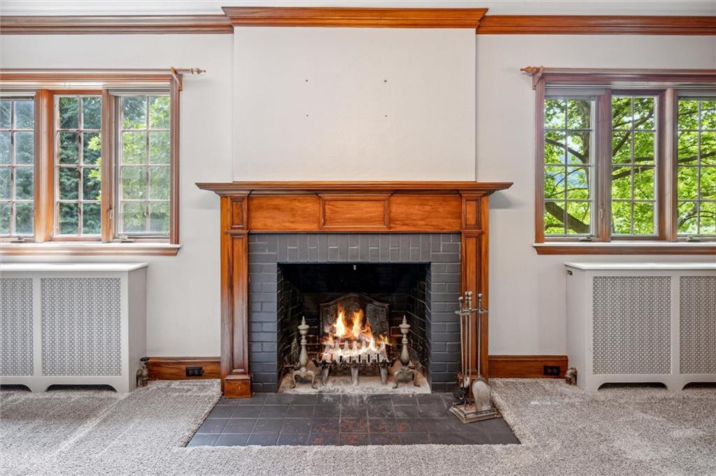 705 Chestnut Street Emlenton, PA 16373 - Photo 8 of 48 a living room with a fireplace with a fireplace