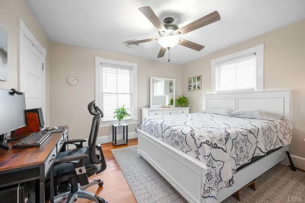 a living room with furniture a table and chairs