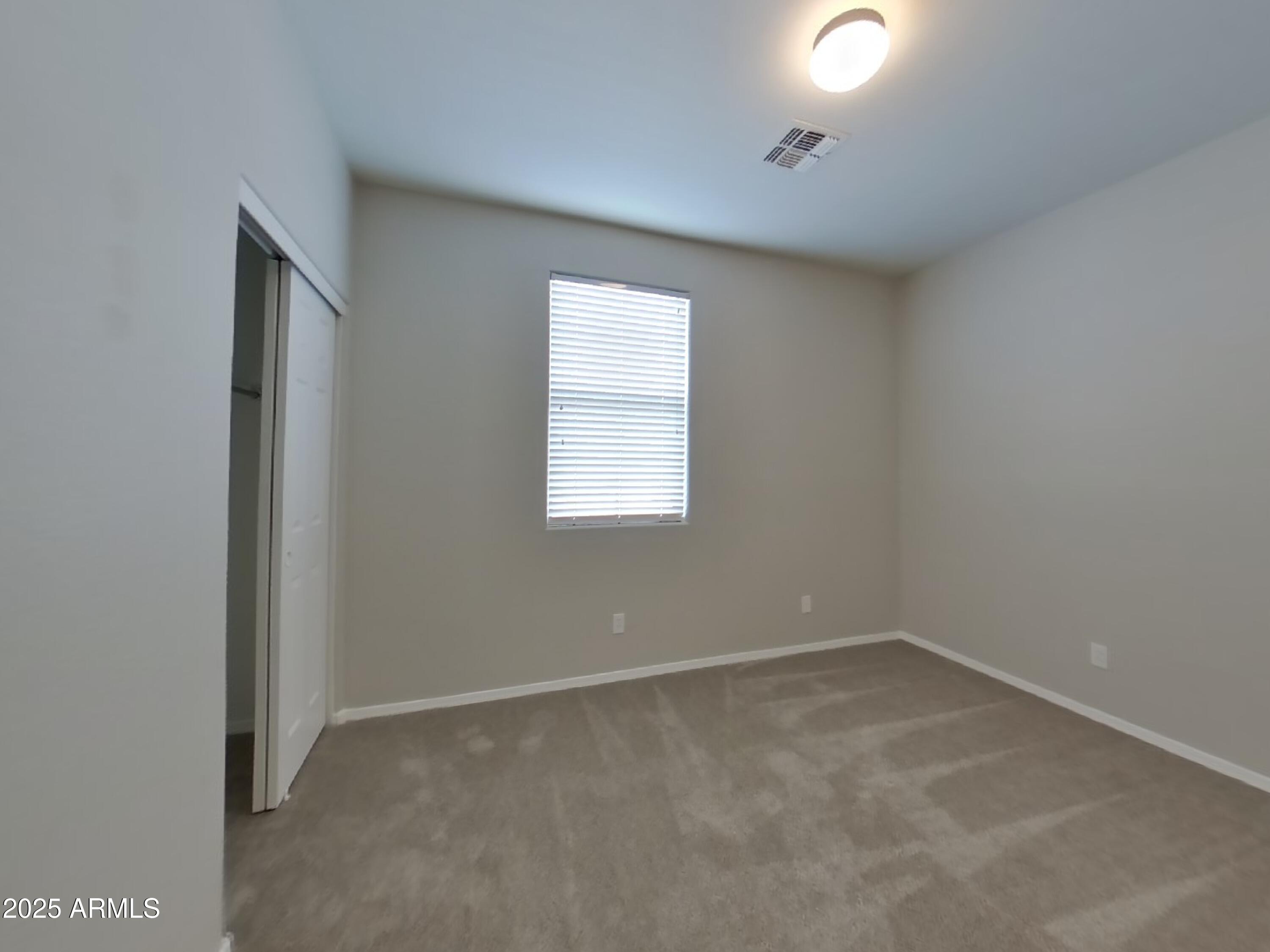 1250 South Rialto, Unit 71 Mesa, AZ 85209 - Photo 10 of 13 an empty room with a window