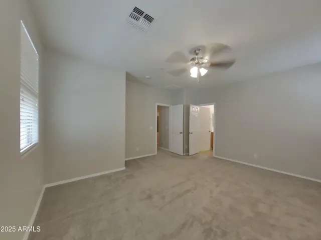 a view of a kitchen with a sink and dishwasher a refrigerator with wooden floor