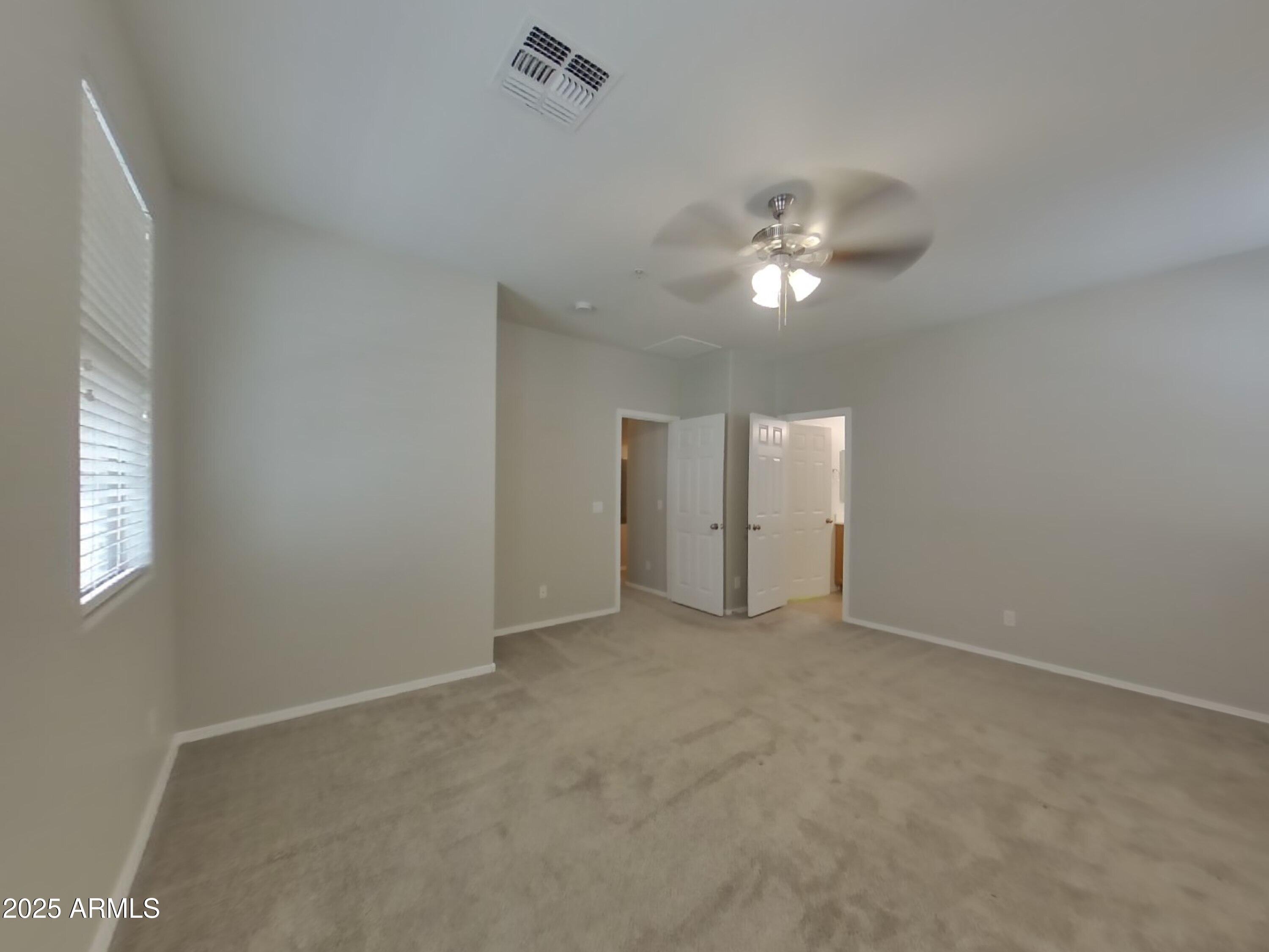 1250 South Rialto, Unit 71 Mesa, AZ 85209 - Photo 5 of 13 a view of an empty room with a ceiling fan