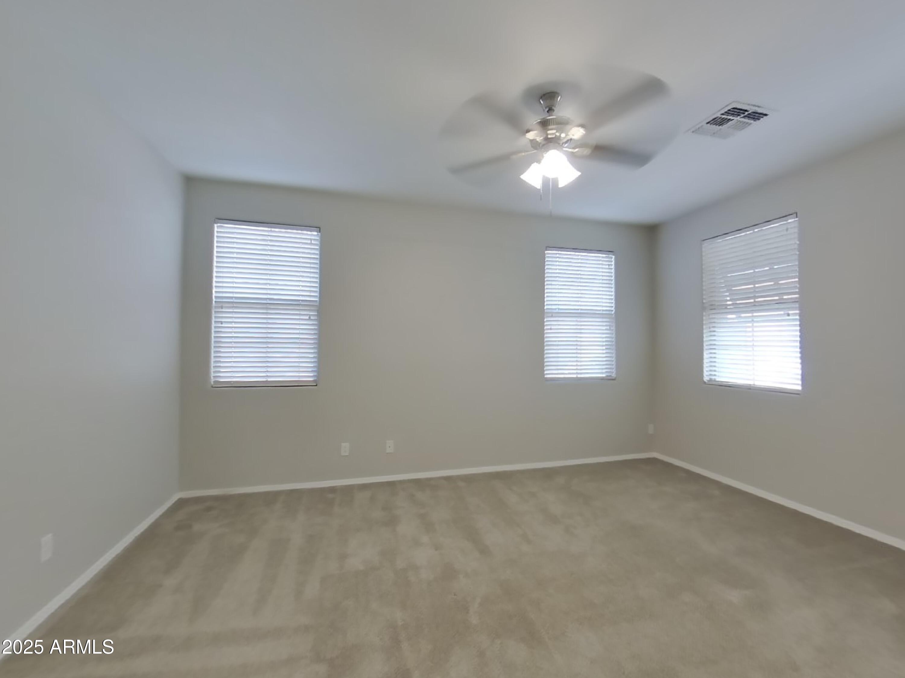 1250 South Rialto, Unit 71 Mesa, AZ 85209 - Photo 6 of 13 a view of a livingroom with a ceiling fan and window