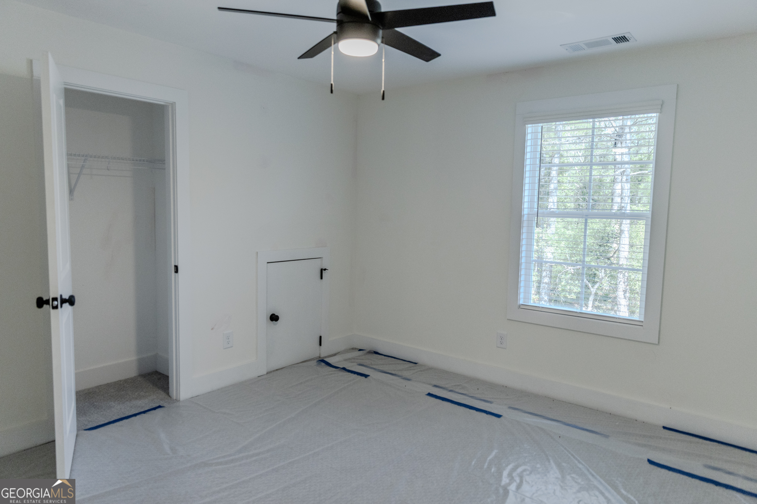 632 Campbell Road Covington, GA 30014 - Photo 39 of 60 a view of an empty room with a window