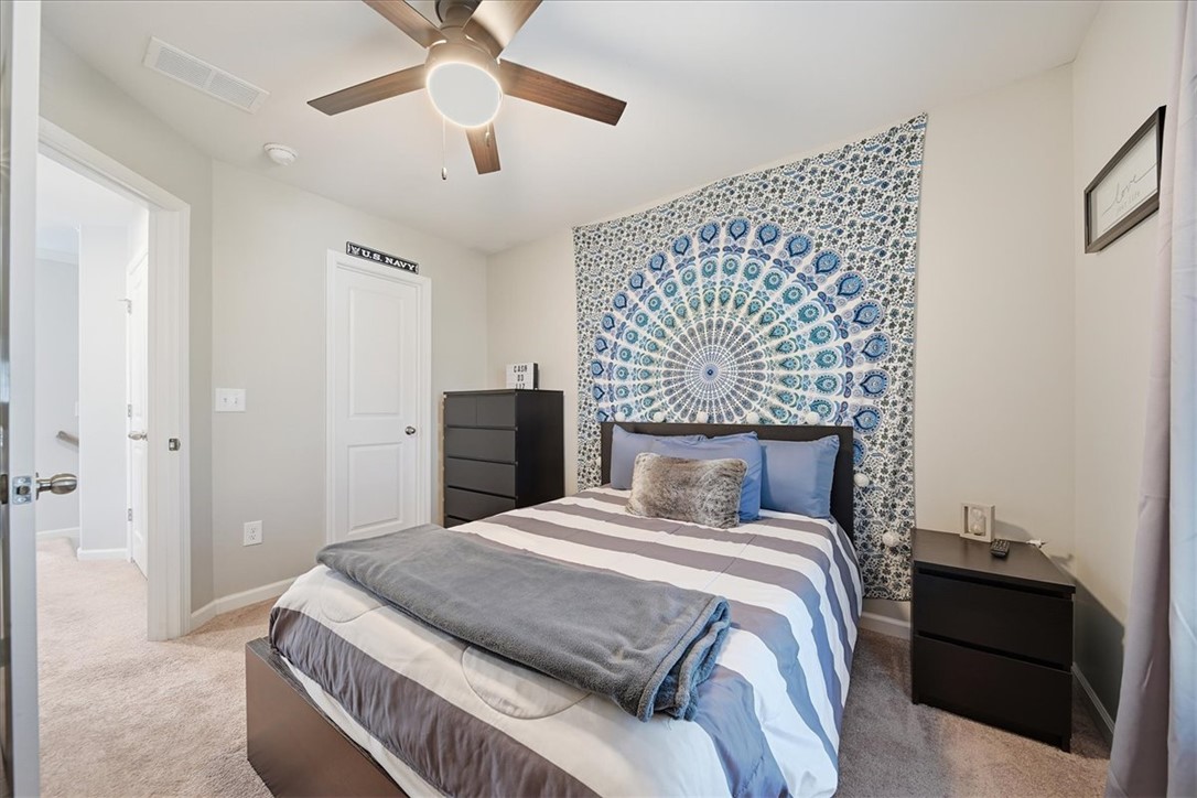 208 Grassy Creek Way Pendleton, SC 29670 - Photo 34 of 43 Well-lit and comfortable, this bedroom features a ceiling fan for year-round comfort.