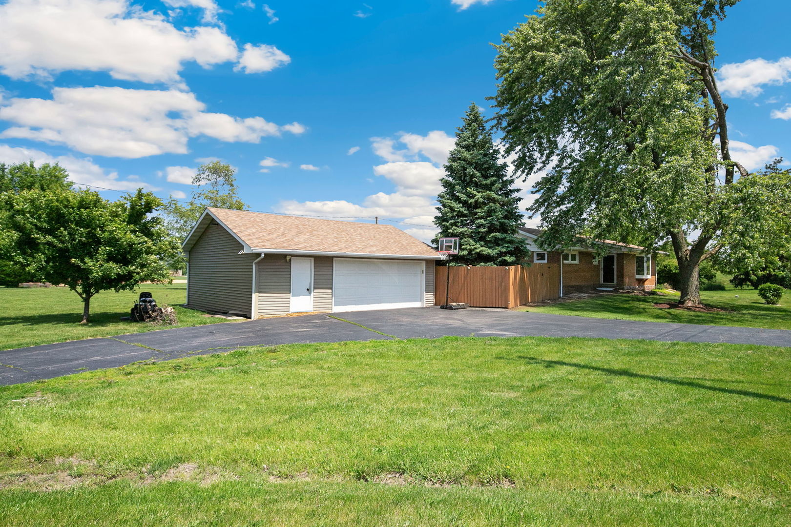 41W822 Burlington Road St. Charles, IL 60175 - Photo 1 of 26 a front view of a house with a yard and trees