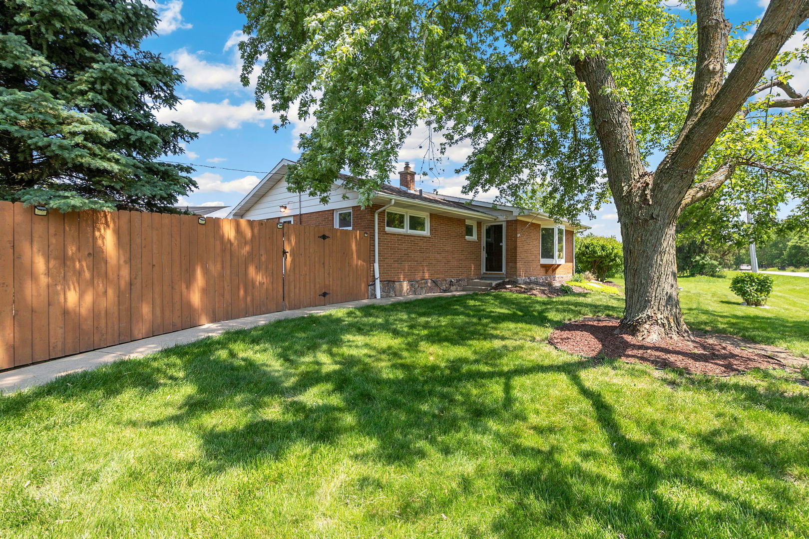 41W822 Burlington Road St. Charles, IL 60175 - Photo 24 of 26 a backyard of a house with seating space