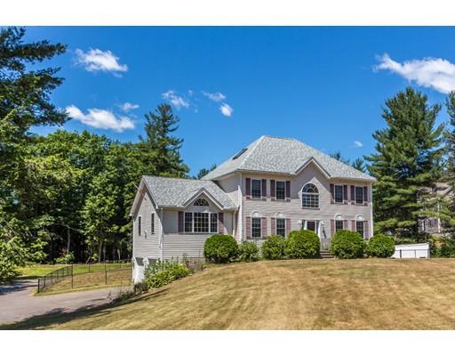 429 Ashby Road Ashburnham, MA 01430 - Photo 1 of 24 a front view of a house with a yard