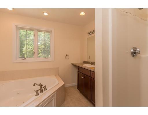 429 Ashby Road Ashburnham, MA 01430 - Photo 15 of 24 a bathroom with a tub sink and mirror