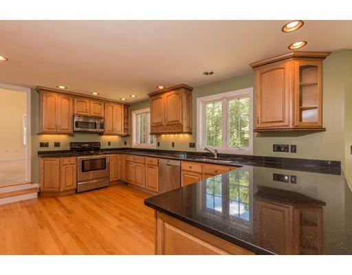 429 Ashby Road Ashburnham, MA 01430 - Photo 2 of 24 a kitchen with stainless steel appliances granite countertop a stove a sink dishwasher and a microwave with wooden floor