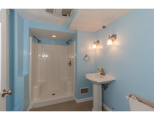 429 Ashby Road Ashburnham, MA 01430 - Photo 21 of 24 a bathroom with a sink mirror and shower