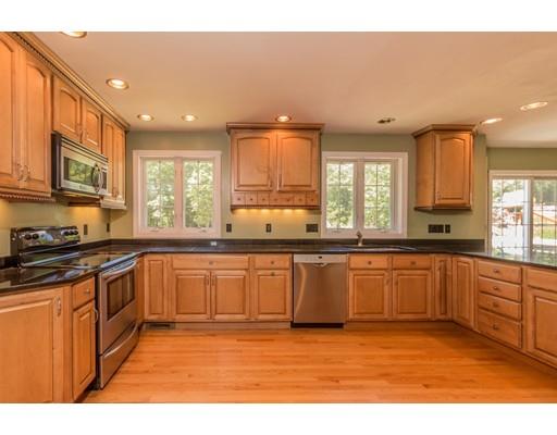 429 Ashby Road Ashburnham, MA 01430 - Photo 3 of 24 a large kitchen with stainless steel appliances granite countertop a stove a sink and a granite counter tops