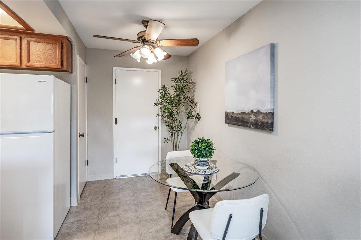 18952 Sara Park Circle Saratoga, CA 95070 - Photo 12 of 21 a view of a dining room with furniture and a chandelier fan