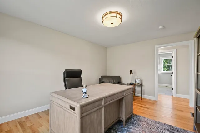 a view of a kitchen that has a stove and a table