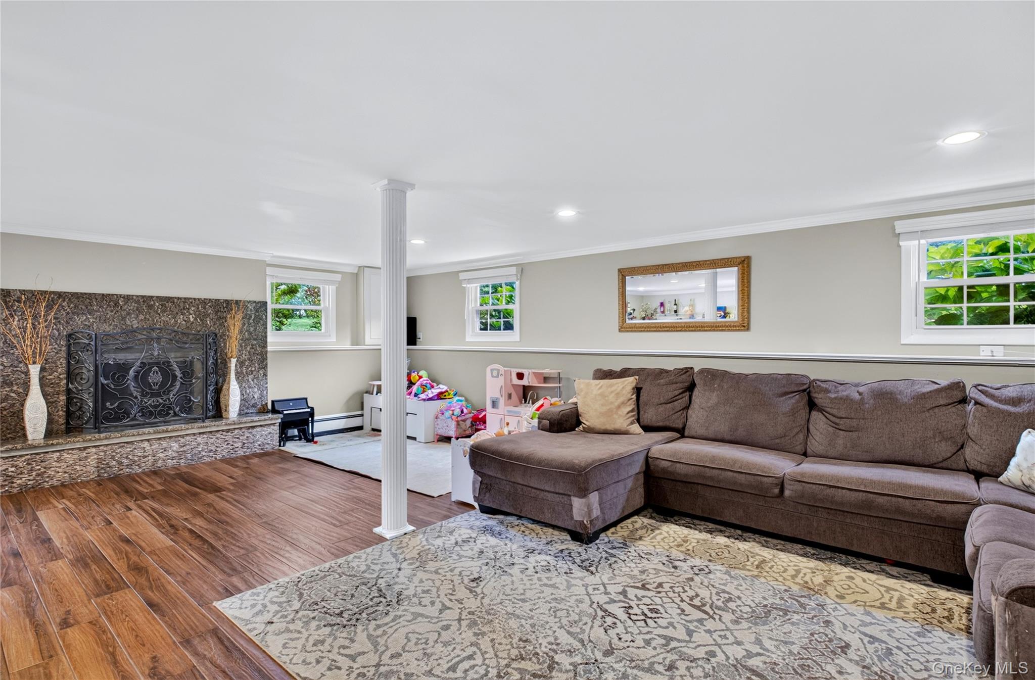 53 Harkin Road Carmel, NY 10512 - Photo 8 of 22 Granite adorned fireplace in Den. Tiled floor. Marble ledge around boarder.