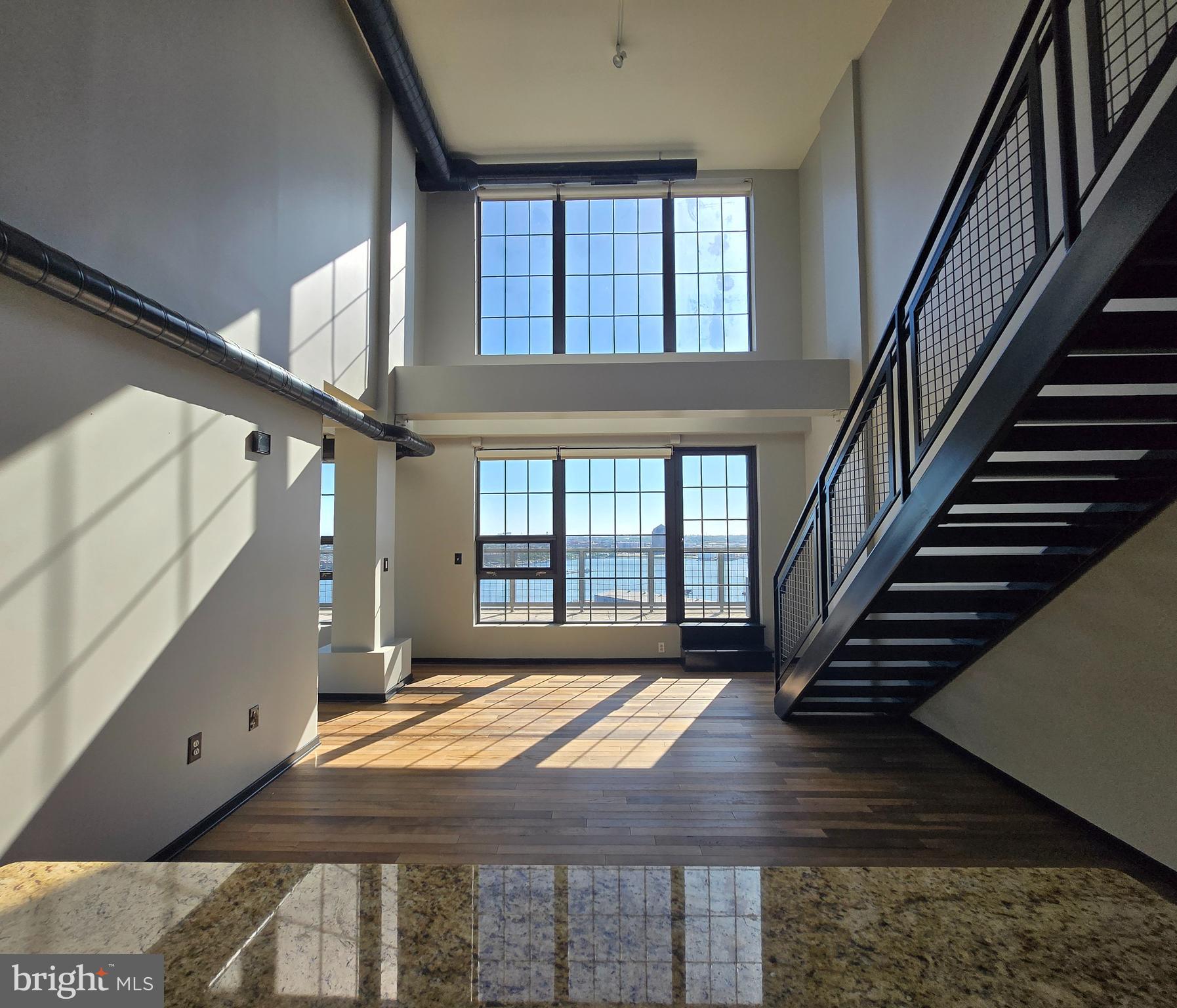 1200 Steuart Street, Unit 1913 Baltimore, MD 21230 - Photo 12 of 57 Soaring two-story Dining room.