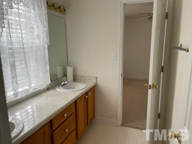 4320 Major Loring Way Raleigh, NC 27616 - Photo 13 of 37 a bathroom with a granite countertop sink and a mirror