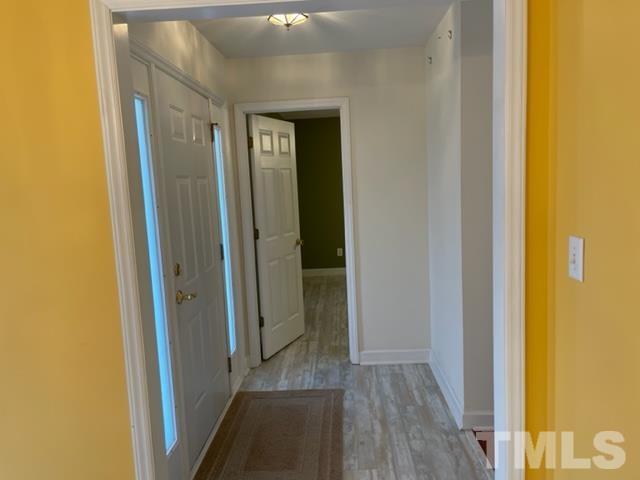 4320 Major Loring Way Raleigh, NC 27616 - Photo 34 of 37 a view of a hallway with wooden floor
