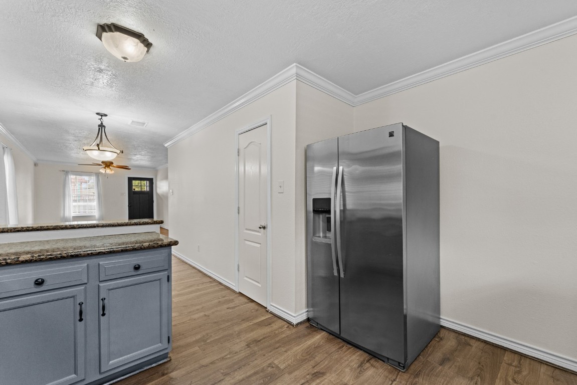842 East 29th Street Houston, TX 77009 - Photo 11 of 24 a kitchen with granite countertop a refrigerator and a sink