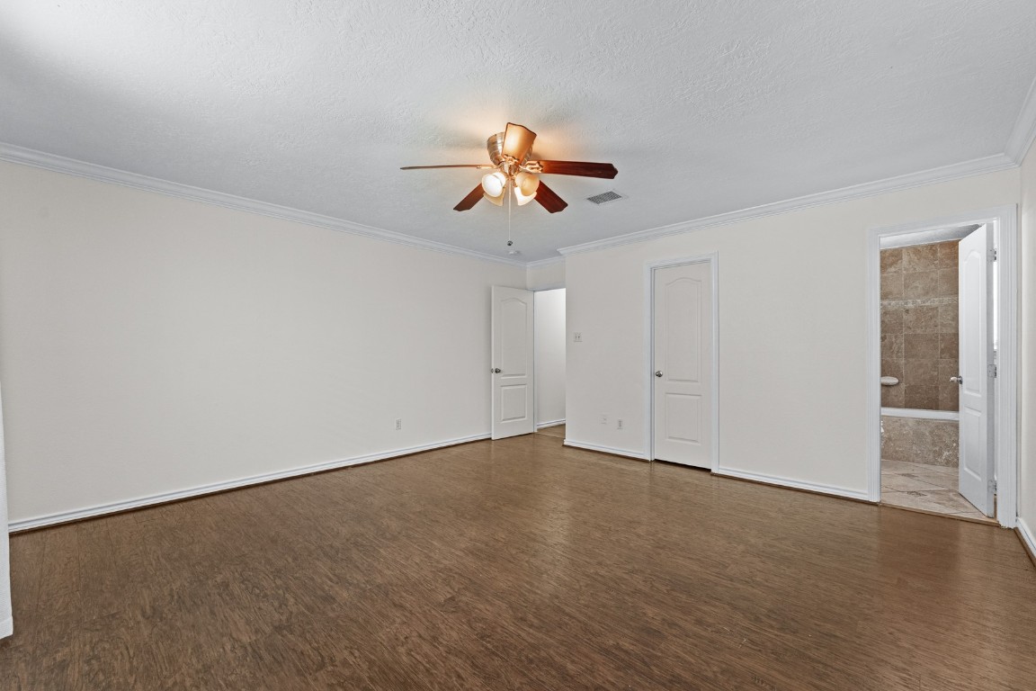 842 East 29th Street Houston, TX 77009 - Photo 13 of 24 a view of a room with a ceiling fan and window