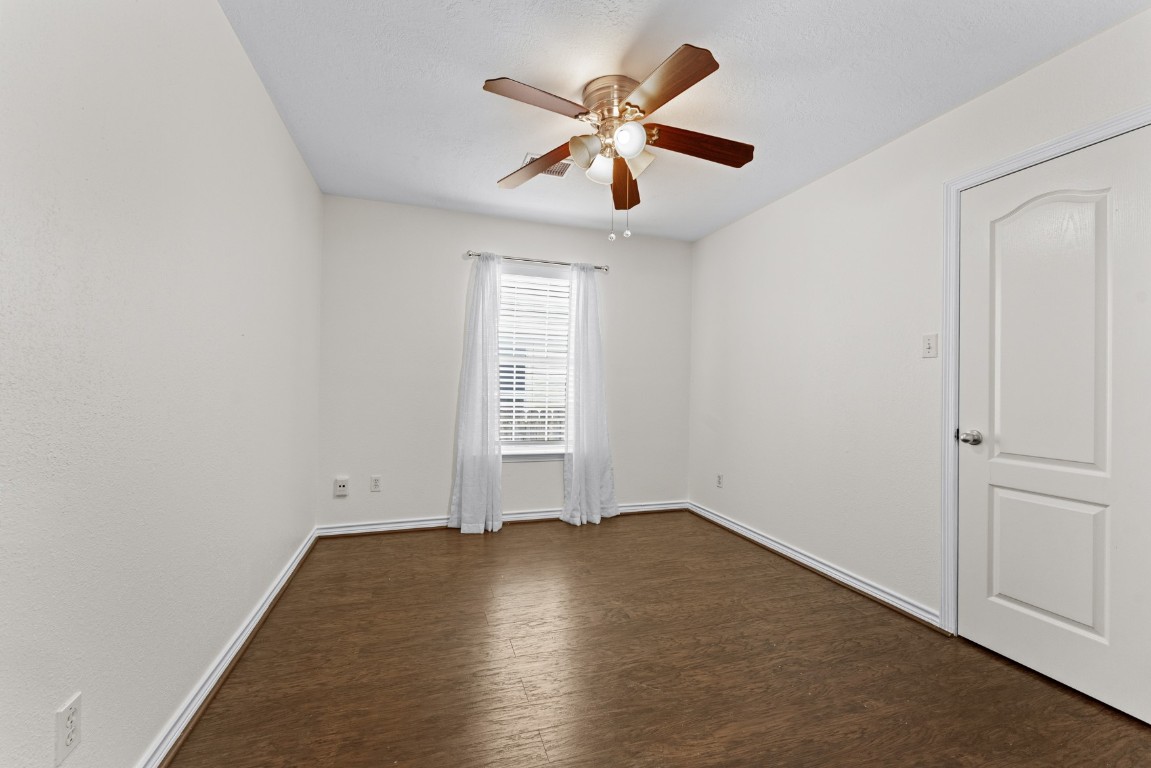842 East 29th Street Houston, TX 77009 - Photo 17 of 24 an empty room with a window and a ceiling fan