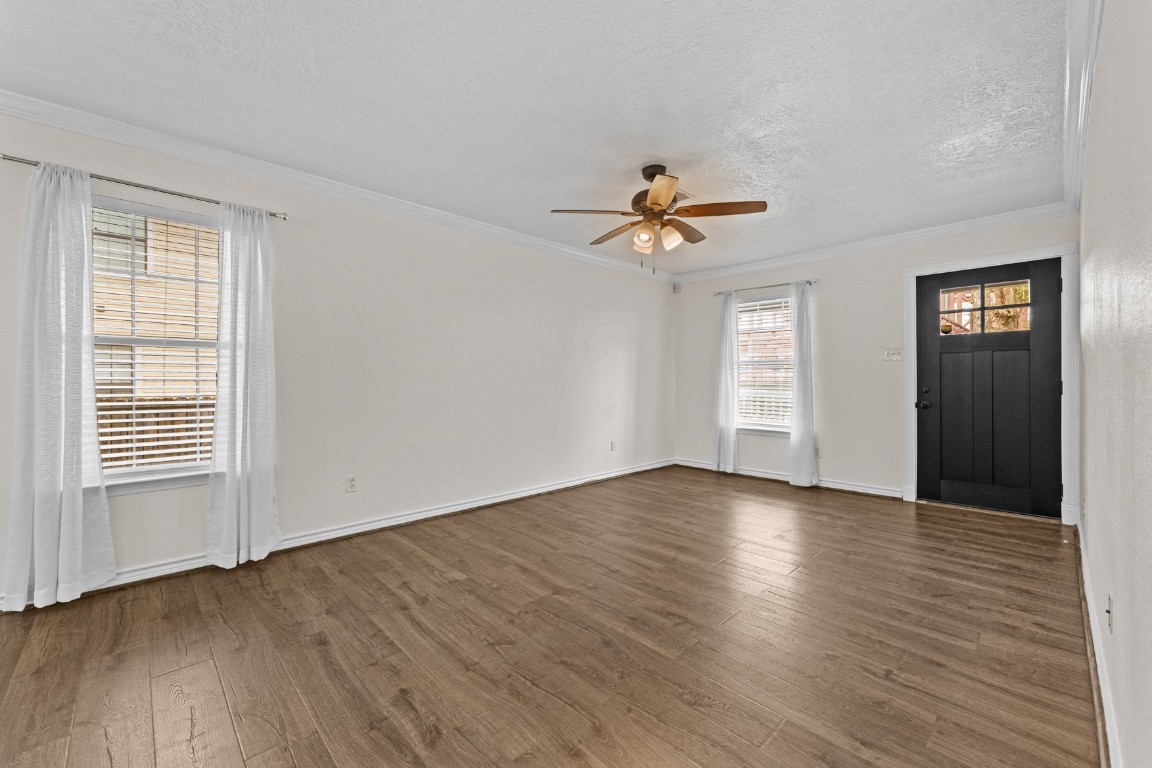 842 East 29th Street Houston, TX 77009 - Photo 7 of 24 a view of an empty room with a window and wooden floor