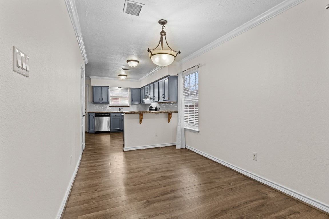 842 East 29th Street Houston, TX 77009 - Photo 8 of 24 a view of a kitchen with a sink cabinets and wooden floor