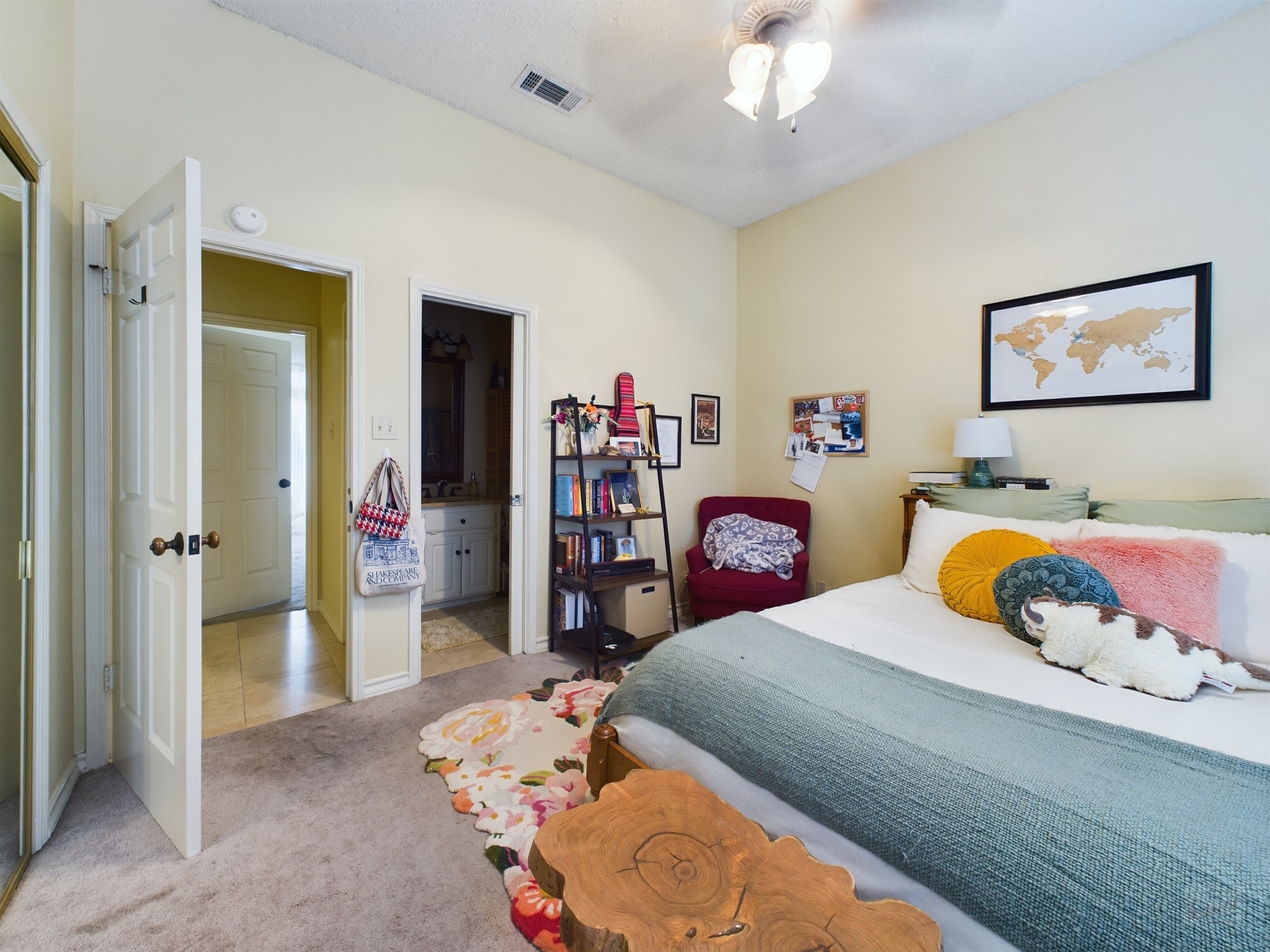 914 West 26th Street, Unit 303 Austin, TX 78705 - Photo 16 of 30 a bedroom with a bed and a chandelier
