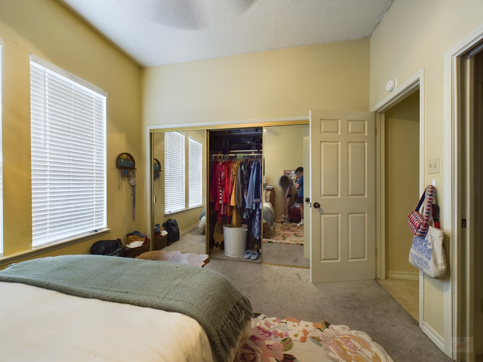 914 West 26th Street, Unit 303 Austin, TX 78705 - Photo 17 of 30 a bed room with a bed and a mirror