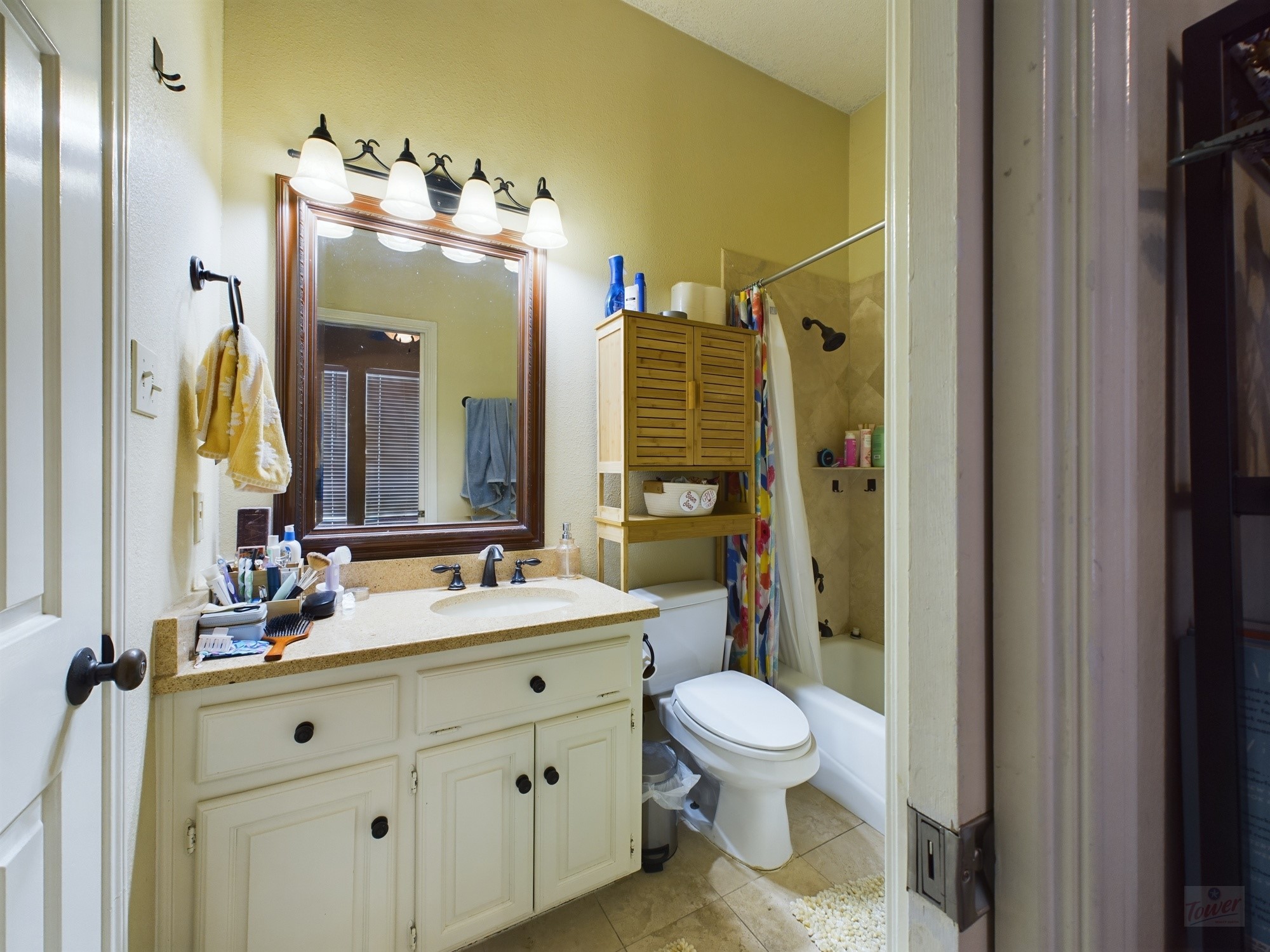 914 West 26th Street, Unit 303 Austin, TX 78705 - Photo 18 of 30 a bathroom with a double vanity sink mirror and toilet