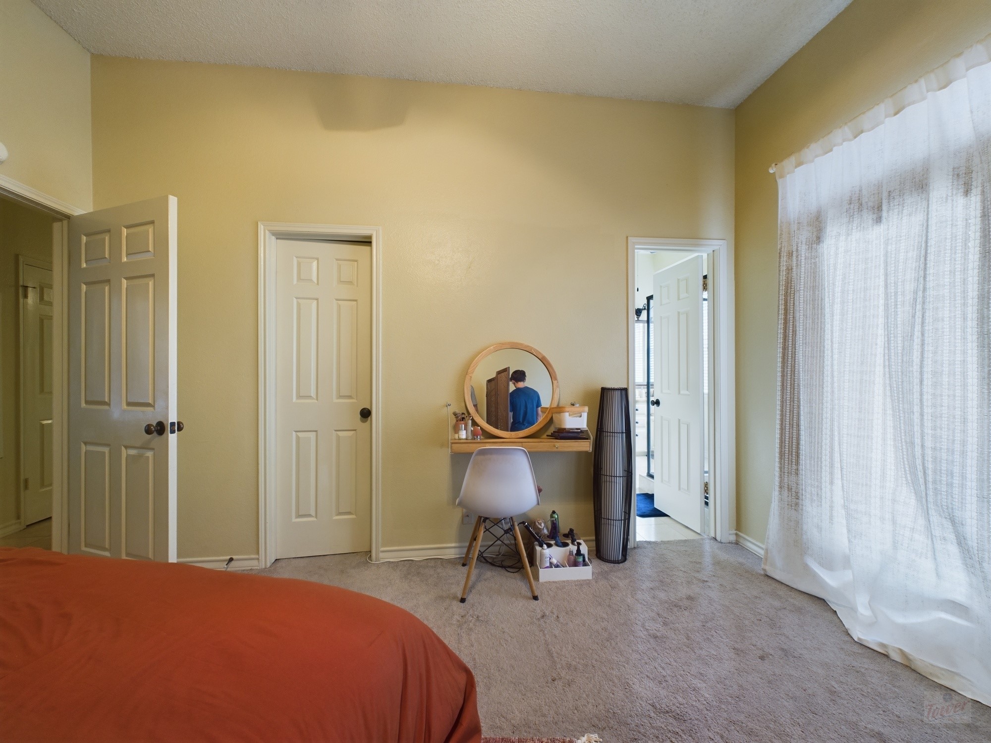 914 West 26th Street, Unit 303 Austin, TX 78705 - Photo 21 of 30 a bed room with a bed and a chair