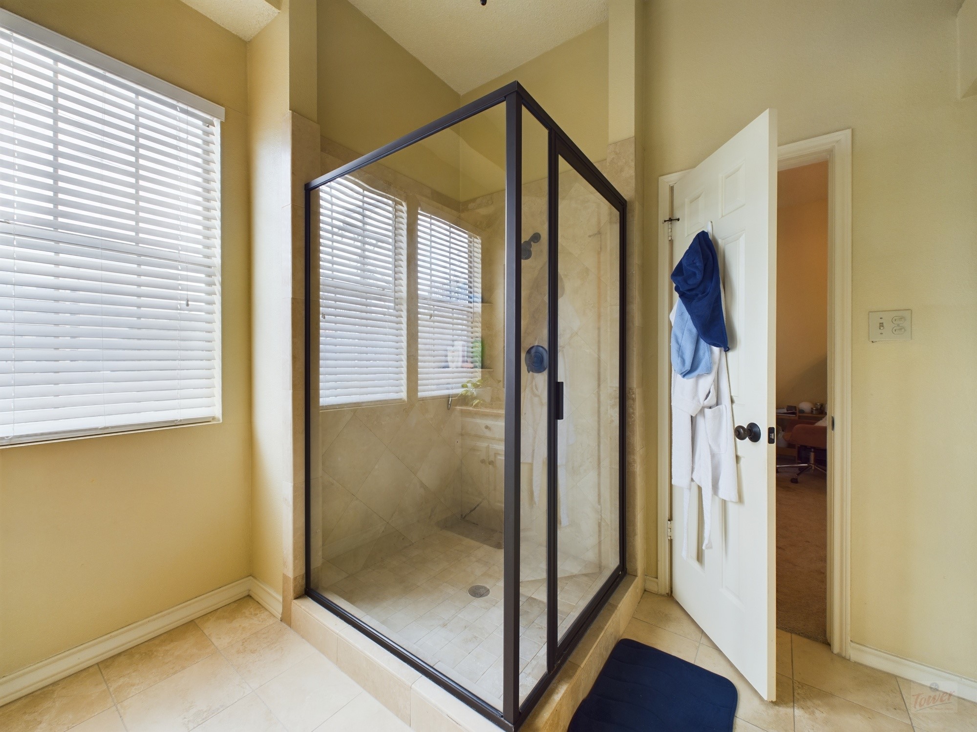 914 West 26th Street, Unit 303 Austin, TX 78705 - Photo 26 of 30 a bathroom with a glass shower door
