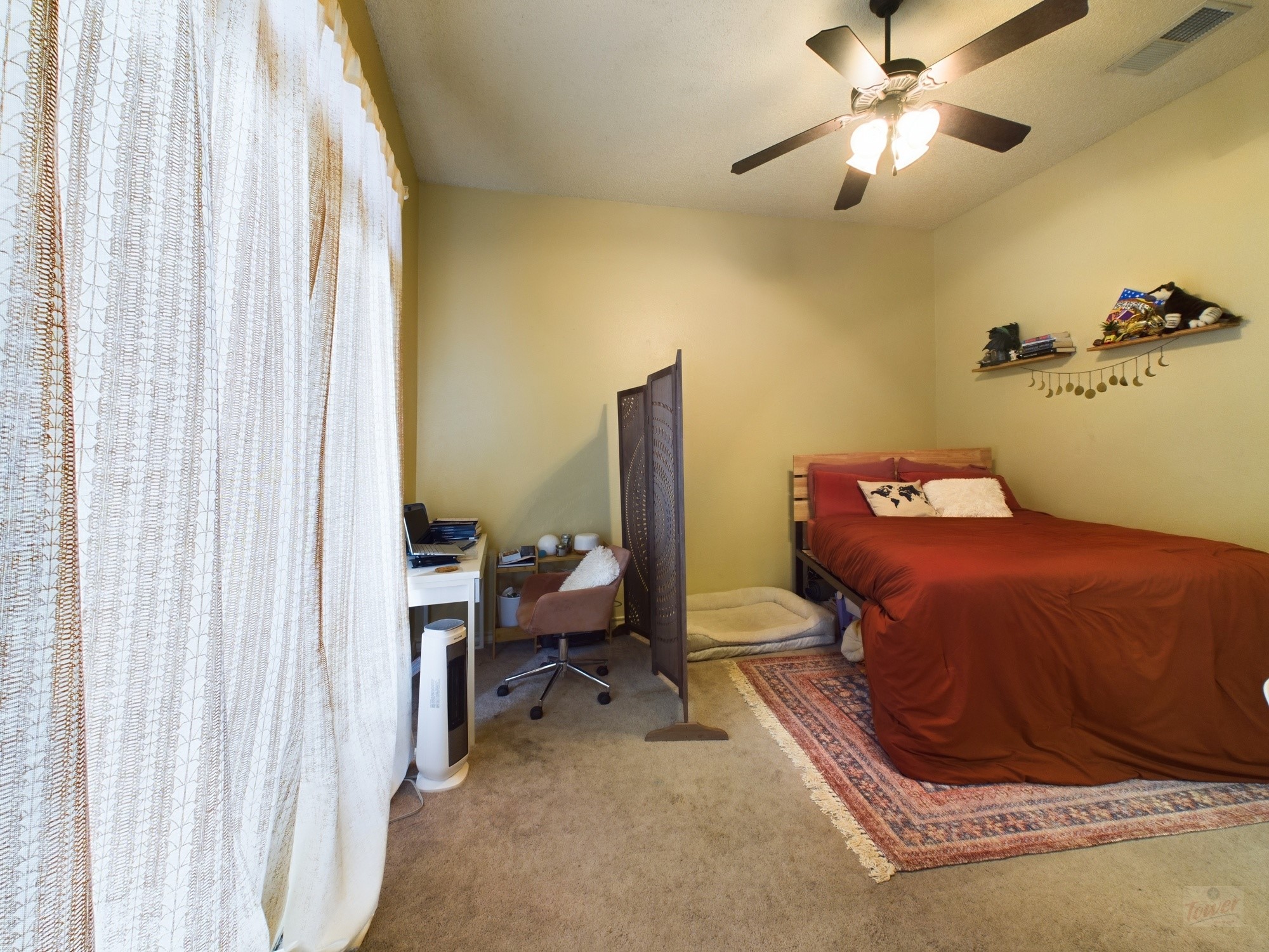 914 West 26th Street, Unit 303 Austin, TX 78705 - Photo 27 of 30 a bedroom with a bed and wooden floor