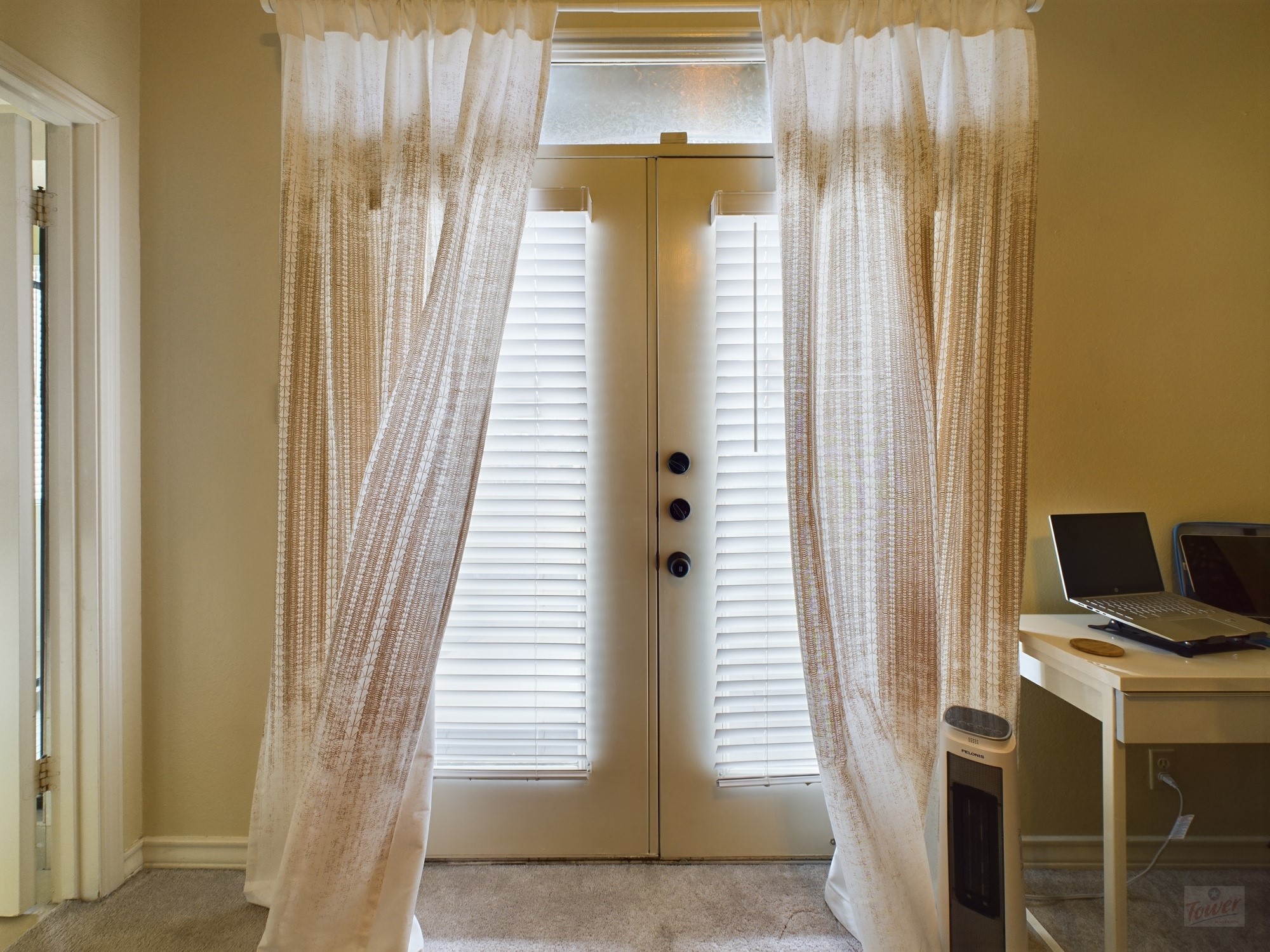 914 West 26th Street, Unit 303 Austin, TX 78705 - Photo 28 of 30 a view of a bedroom with windows