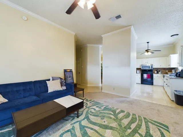 a living room with furniture and a couch