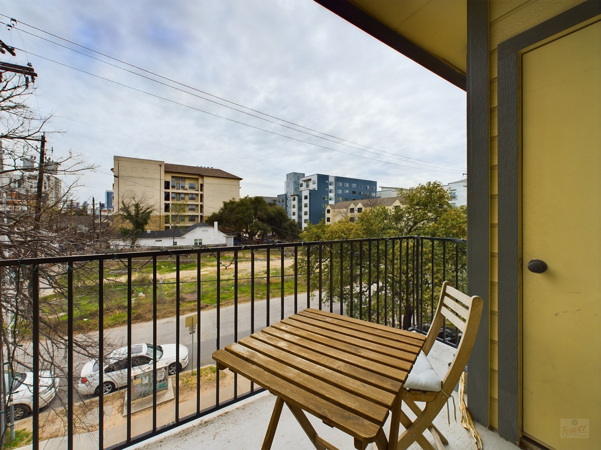 914 West 26th Street, Unit 303 Austin, TX 78705 - Photo 10 of 30 a view of a balcony with wooden floor next to a lake