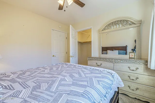 a bedroom with a bed and a fireplace