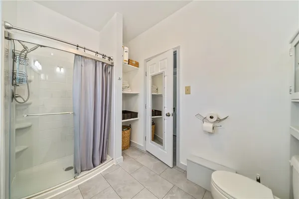a bathroom with a shower and a toilet