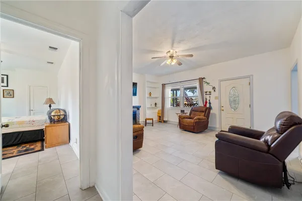a living room with furniture and a gym