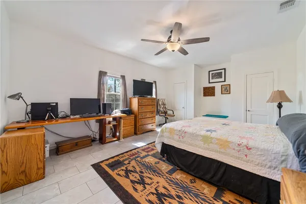 a bed room with a bed and dresser