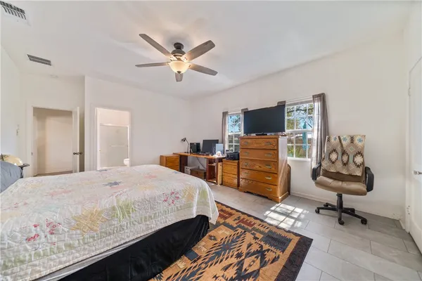 a bedroom with a bed and furniture