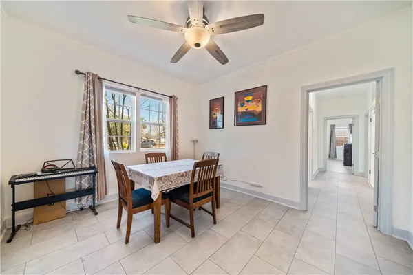 a view of a livingroom with furniture and a window