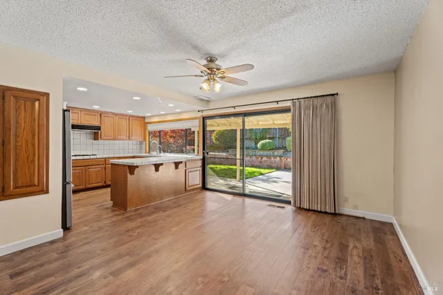 a view of a kitchen with a sink and a window
